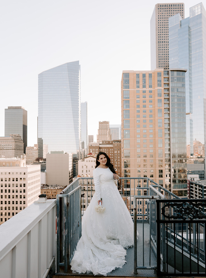 The bride standing on the rooftop of the Hotel ICON. 