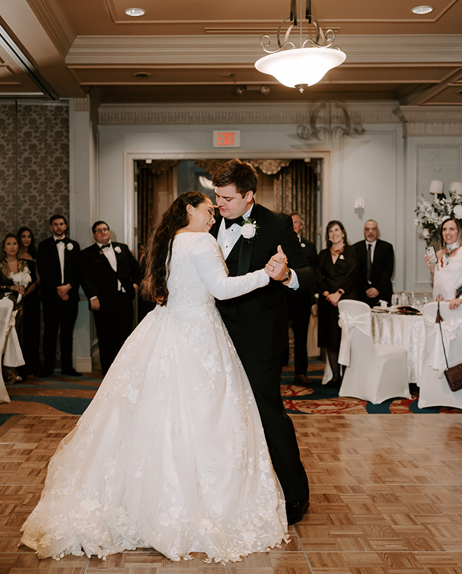 A bride and groom dancing in the ballroom of Hotel ICON. 