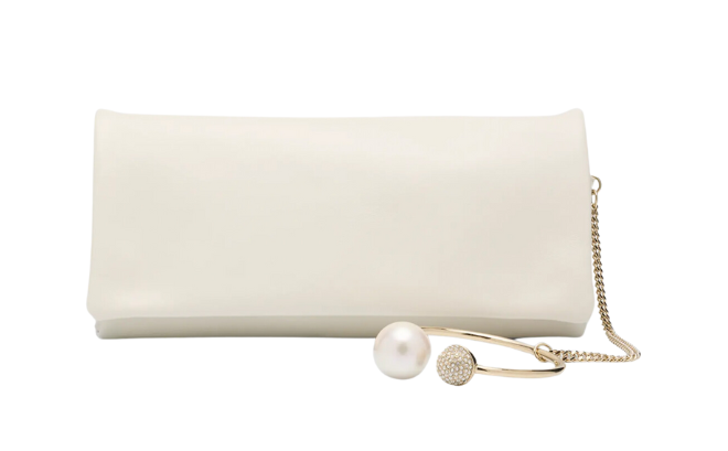 White rectangular wallet with a pearl wristlet. 