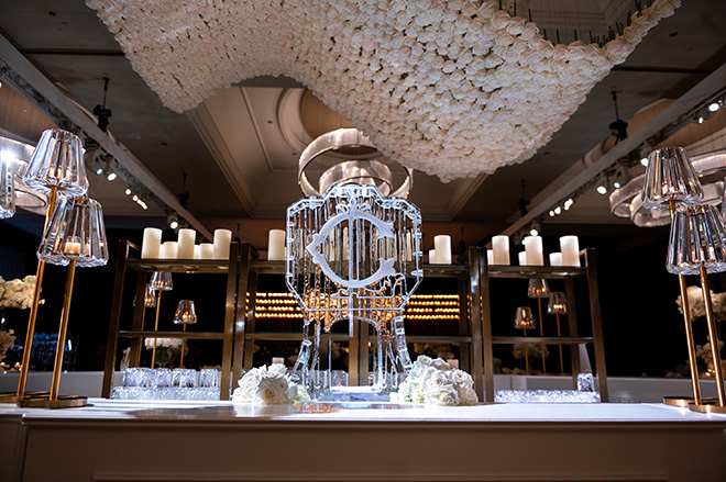 An ice sculpture with the couple's initial of their last name decorate the bar.