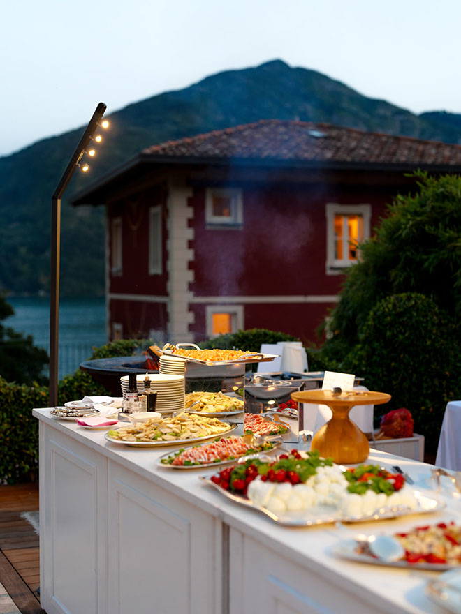 Pizza and pasta are served to guests at the welcome dinner.