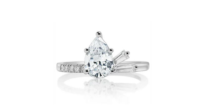 A pear shaped diamond cluster engagement ring is available at Houston jeweler, Zadok Jewelers.