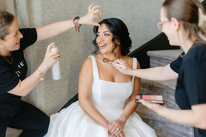 Polished Makeup and Hair touches up the bride's makeup and hair. 