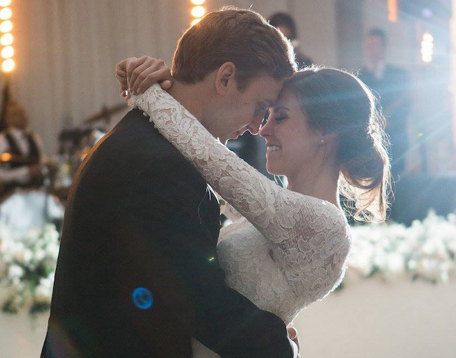 The bride and groom dance their first dance choreographed by a wedding choreographer.