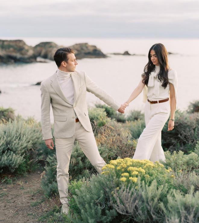 An engaged couple take engagement photos at Big Sur. 