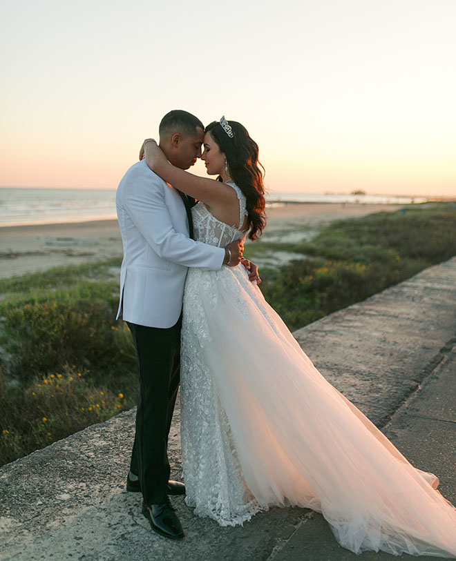 The bride and groom wed with a beachside wedding in Galveston, Texas.