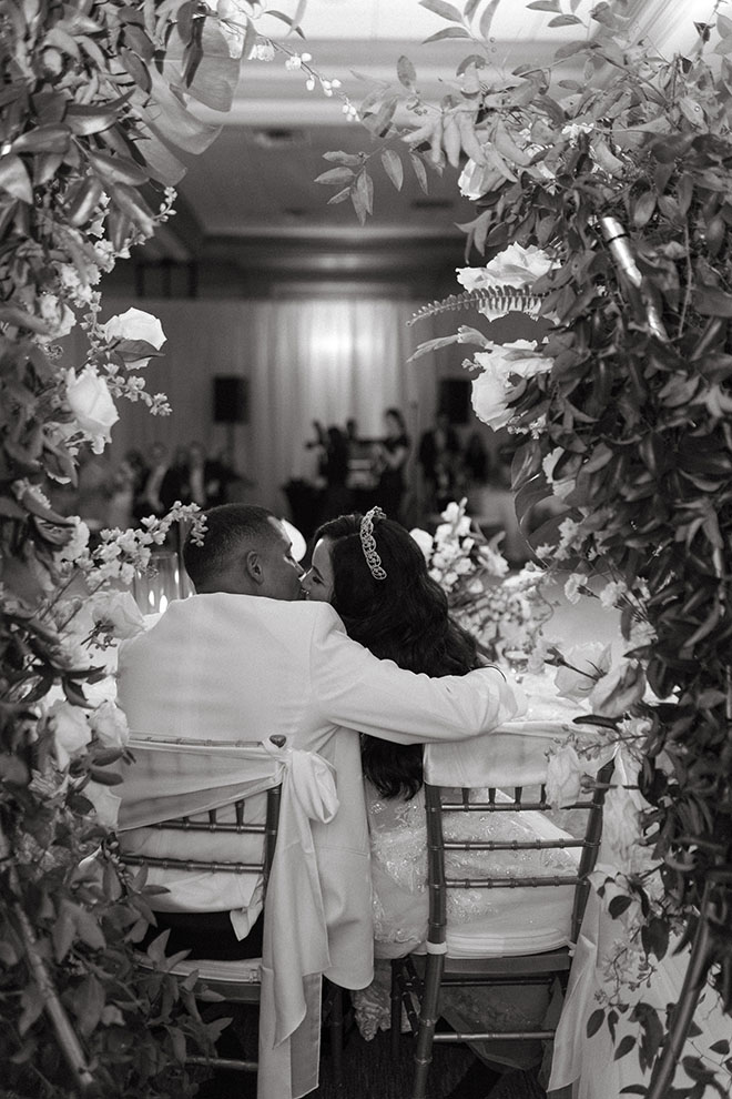 The bride and groom share a kiss at their beachside wedding at The San Luis Resort, Spa and Conference Center.