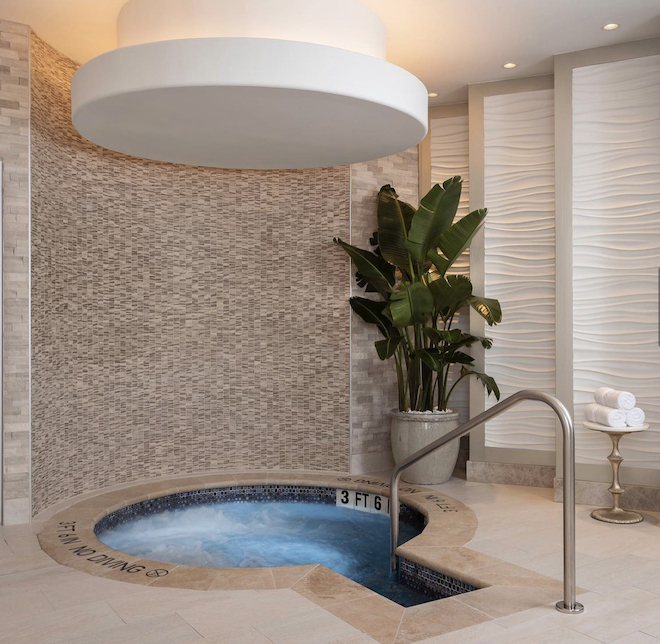 At Trellis Spa, there is a hot tub experience enhanced by an overhead rain shower.