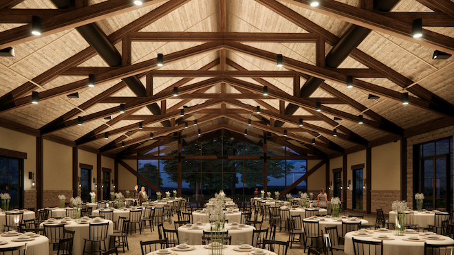 The interior of the Riverbend Barn at the Hyatt Regency Lost Pines Resort & Spa features vaulted ceilings and exposed beams.