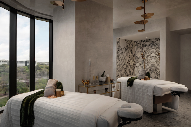 The couple's massage room with a marbled shower and floor-to-ceiling windows. 